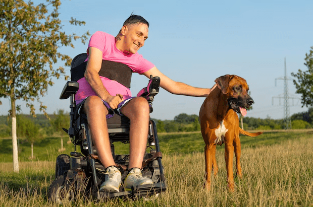 Wheelchair Manufacturers in Canada | Wheelchair Canada | Protecting Your Wheelchair from Pet Damage: Essential Tips for Pet-Owning Wheelchair Userswith-dog